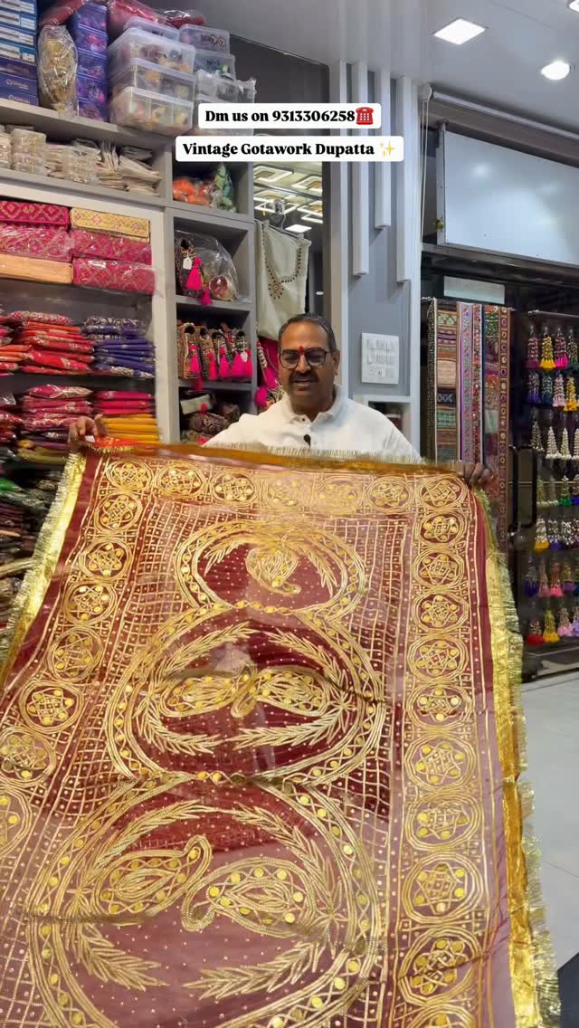 Original shop photograph of a maroon and gold traditional dupatta
